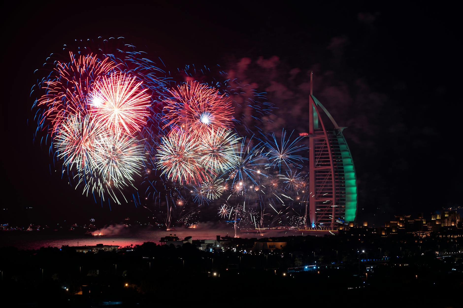 Colorful fireworks over Burj Al Arab at night