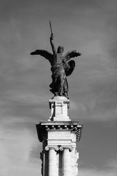 Free A striking black and white photo of an angel statue in Rome, showcasing classical architecture. Stock Photo