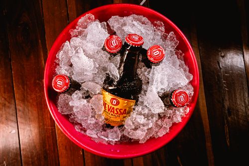 Free Ice bucket with multiple beer bottles chilling, perfect for gatherings and parties. Stock Photo