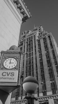 Monochrome view of Manhattan architecture featuring CVS pharmacy clock tower. 28902931
