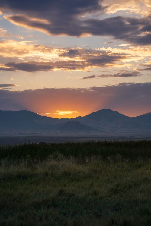 Free Stunning sunset view with dramatic clouds over Utah's mountainous landscape in Wendover. Stock Photo