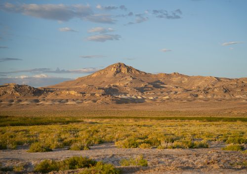 Free Expansive desert scene near Wendover, Utah, capturing golden tones and distant mountains. Stock Photo