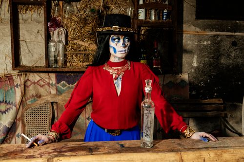 Free A striking portrait of a woman in Day of the Dead makeup, with vibrant colors and cultural elements. Stock Photo