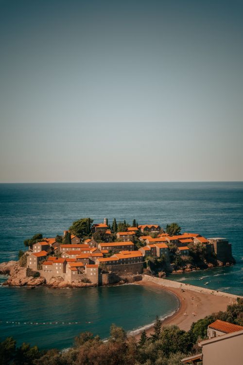 Free A stunning aerial view of Sveti Stefan island in Montenegro, showcasing its unique architecture and turquoise waters. Stock Photo