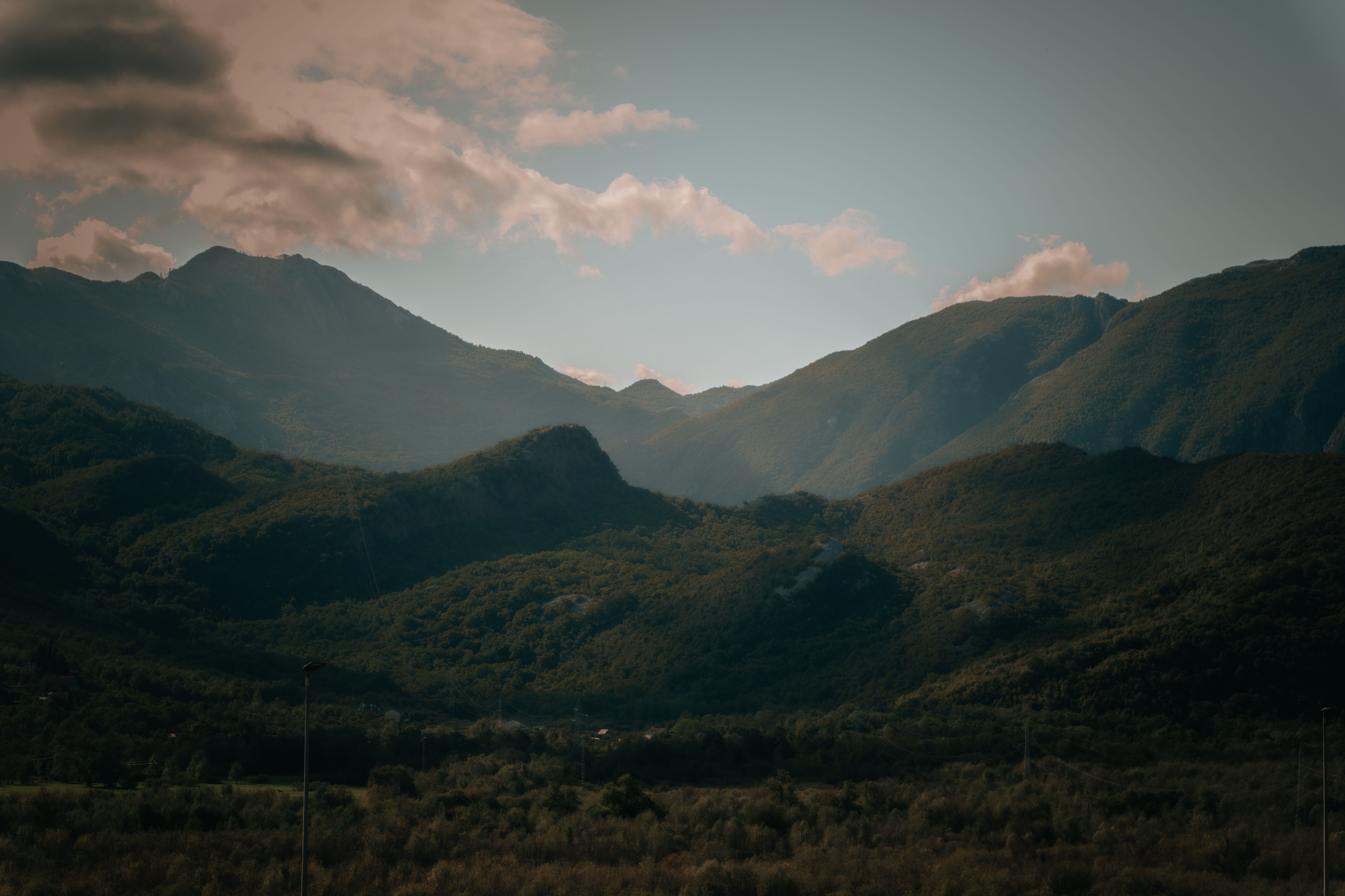 Serene Mountain Landscape Under Cloudy Sky · Free Stock Photo