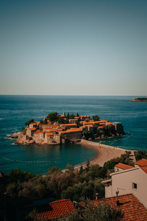 Free Beautiful aerial view of Sveti Stefan island surrounded by azure waters. Stock Photo
