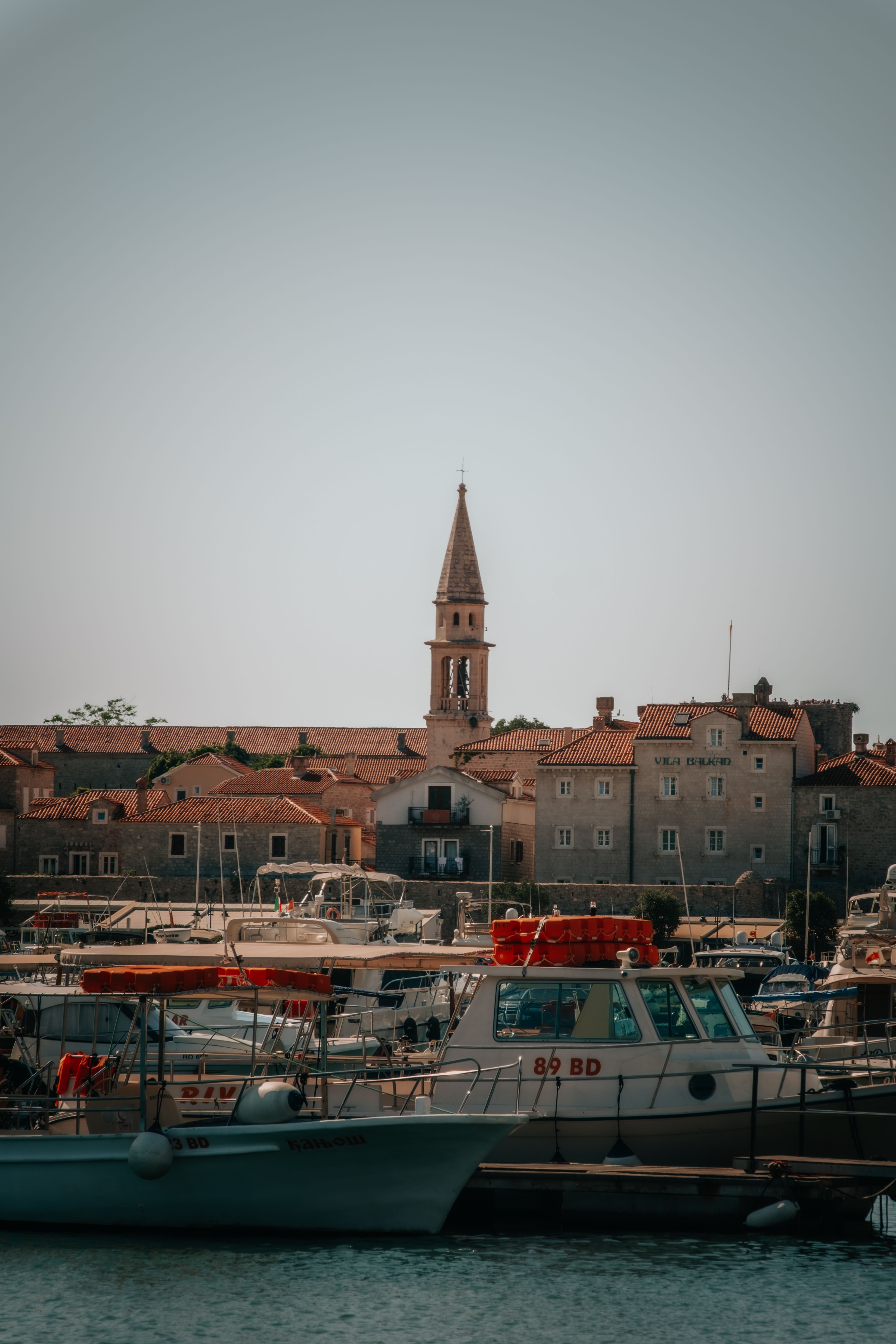 Scenic View of Boats Docked in Coastal Town Harbor · Free Stock Photo
