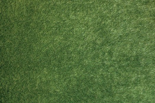 Close-up of a lush green grass texture, perfect for backgrounds.