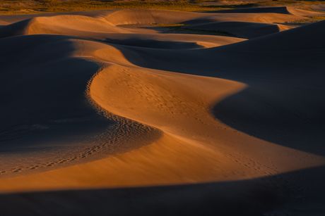 Sand dunes at sunset by Sergey Guk on Pexels