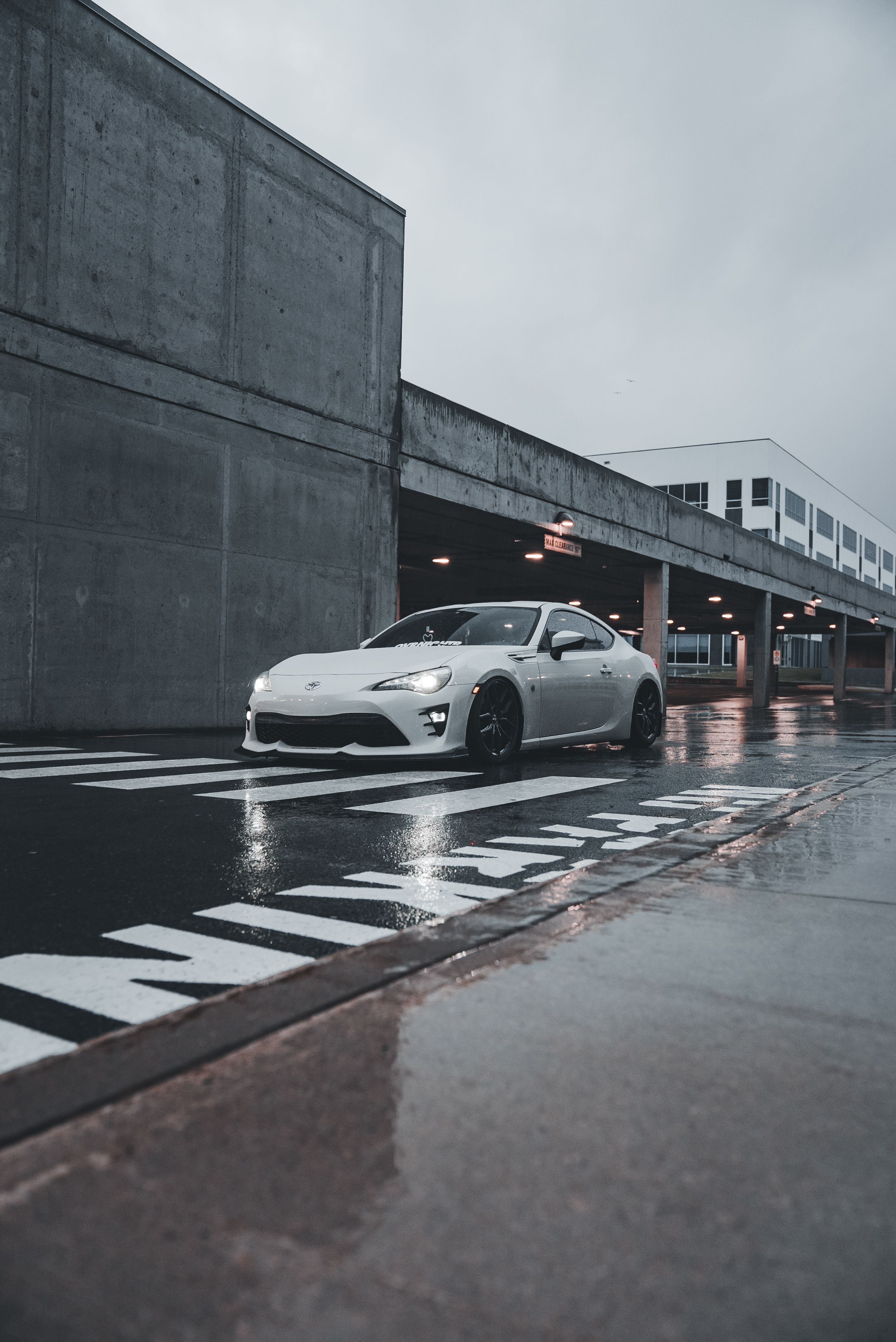 Sleek White Sports Car on Urban Street · Free Stock Photo