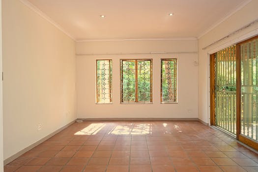 Bright and empty room with terracotta tiles, ready for interior design and decoration.