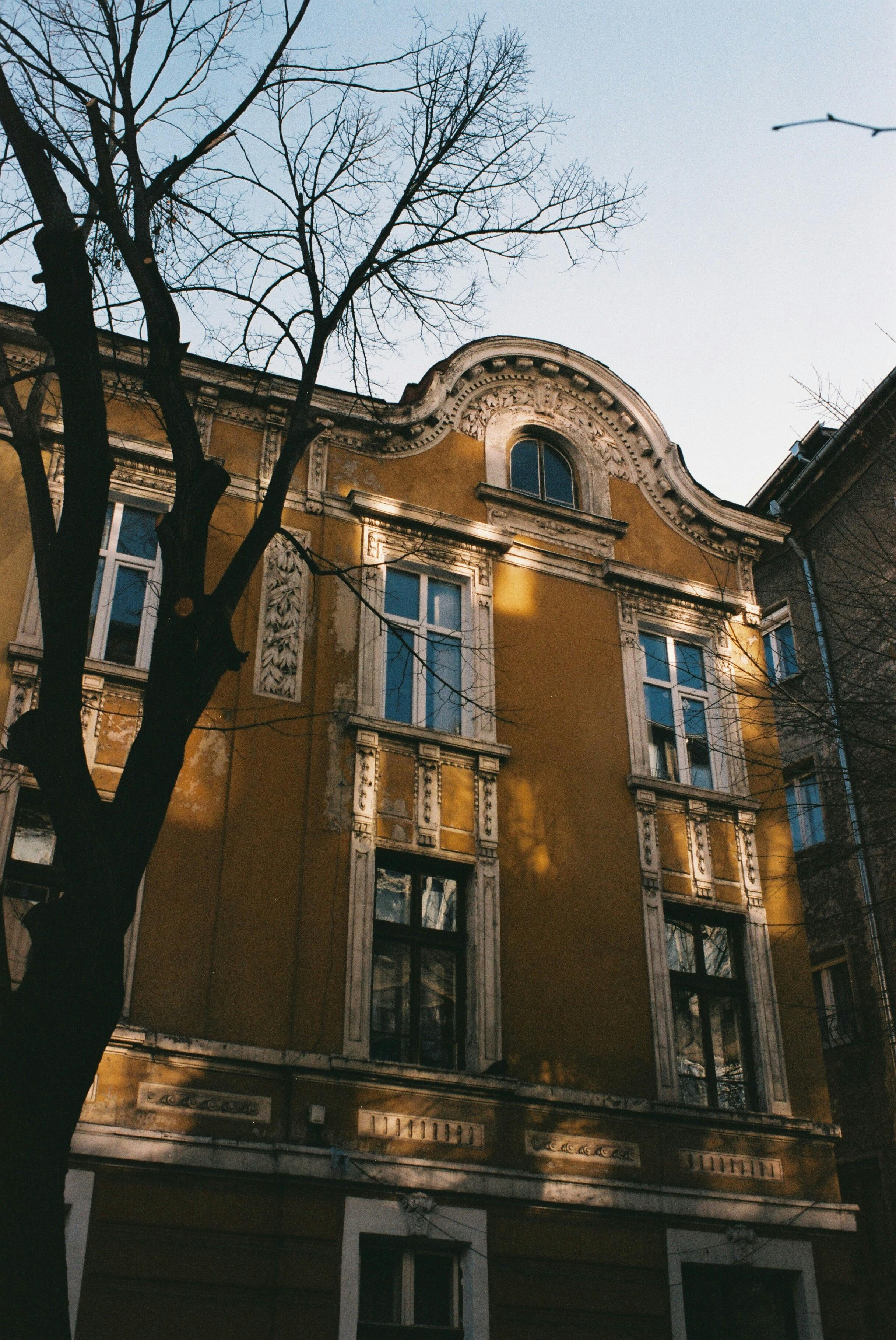 Elegant historic building facade in Sofia captured on film with vintage tones.