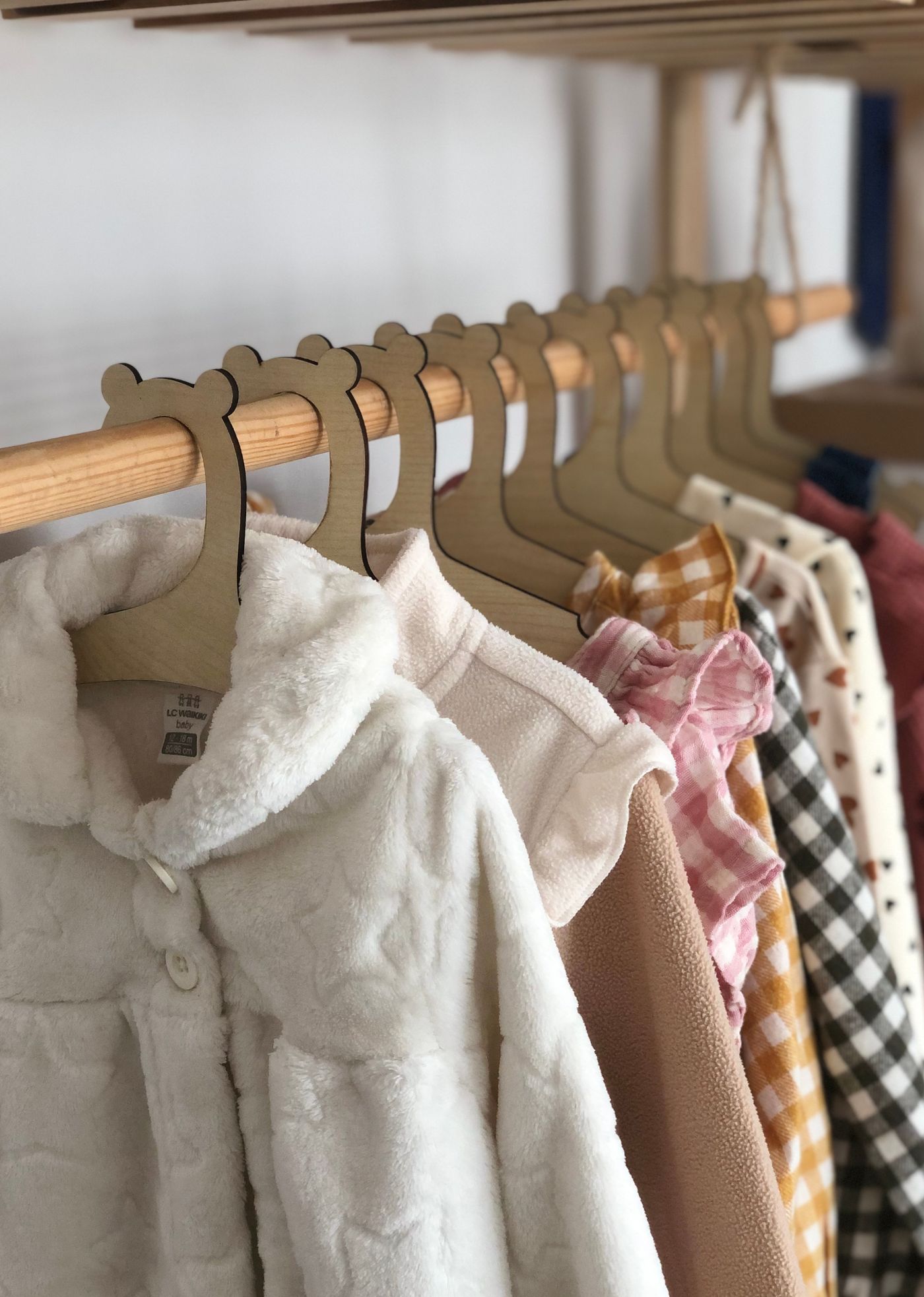 Children's knitwear arranged on hangers