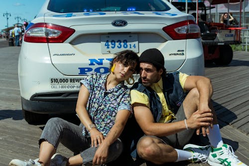 Free Man And Woman Posing Behind A Car Stock Photo