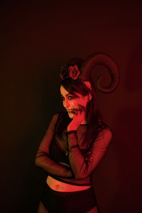 Free Mysterious woman in dark costume with horns and makeup, perfect for fantasy concepts. Stock Photo