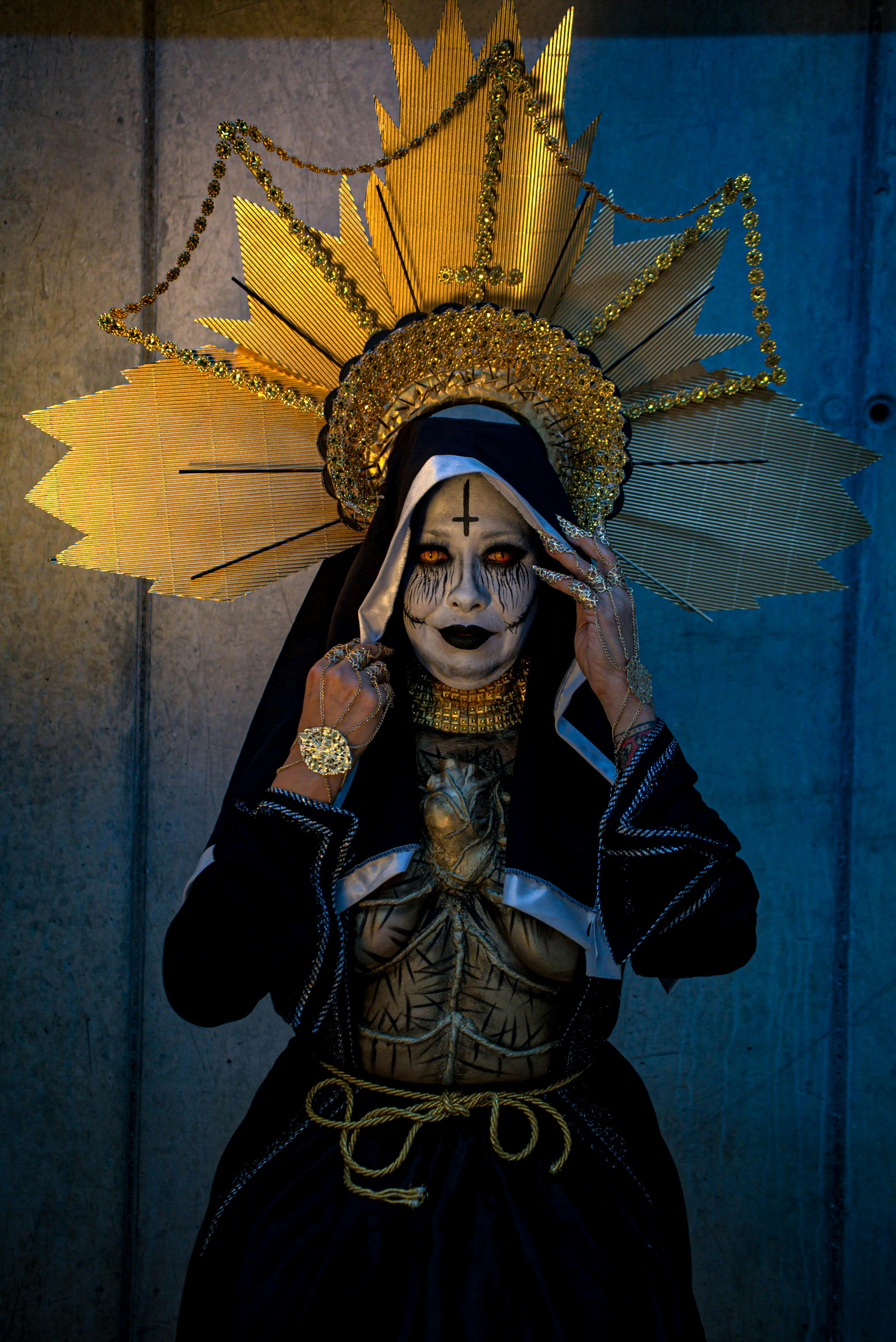 artistic costume with dramatic makeup and headpiece