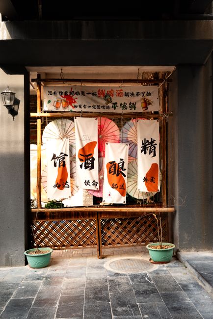 Japanese style shop banners with colorful umbrellas creating a vibrant street scene.