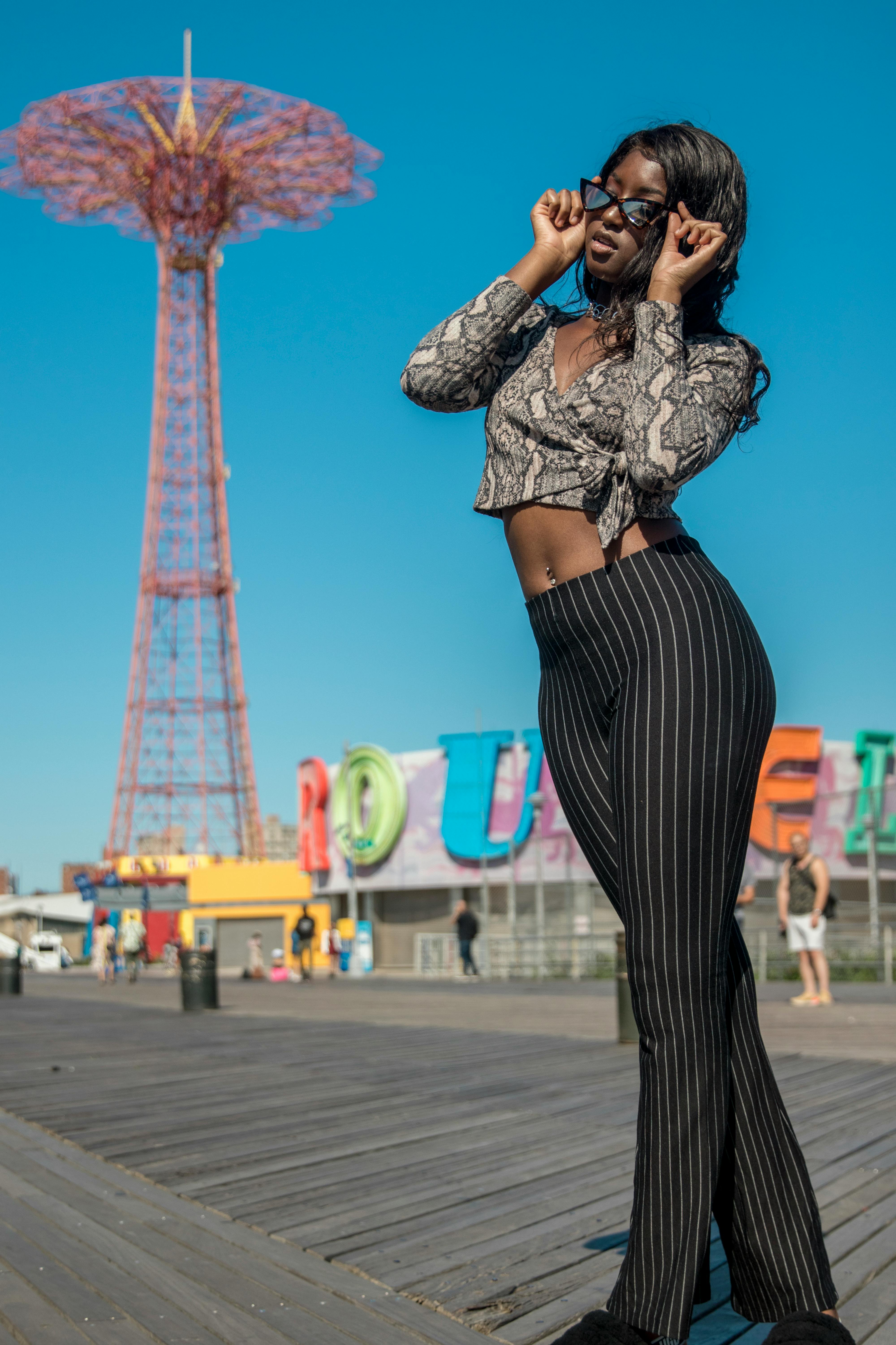 woman holding her sunglasses