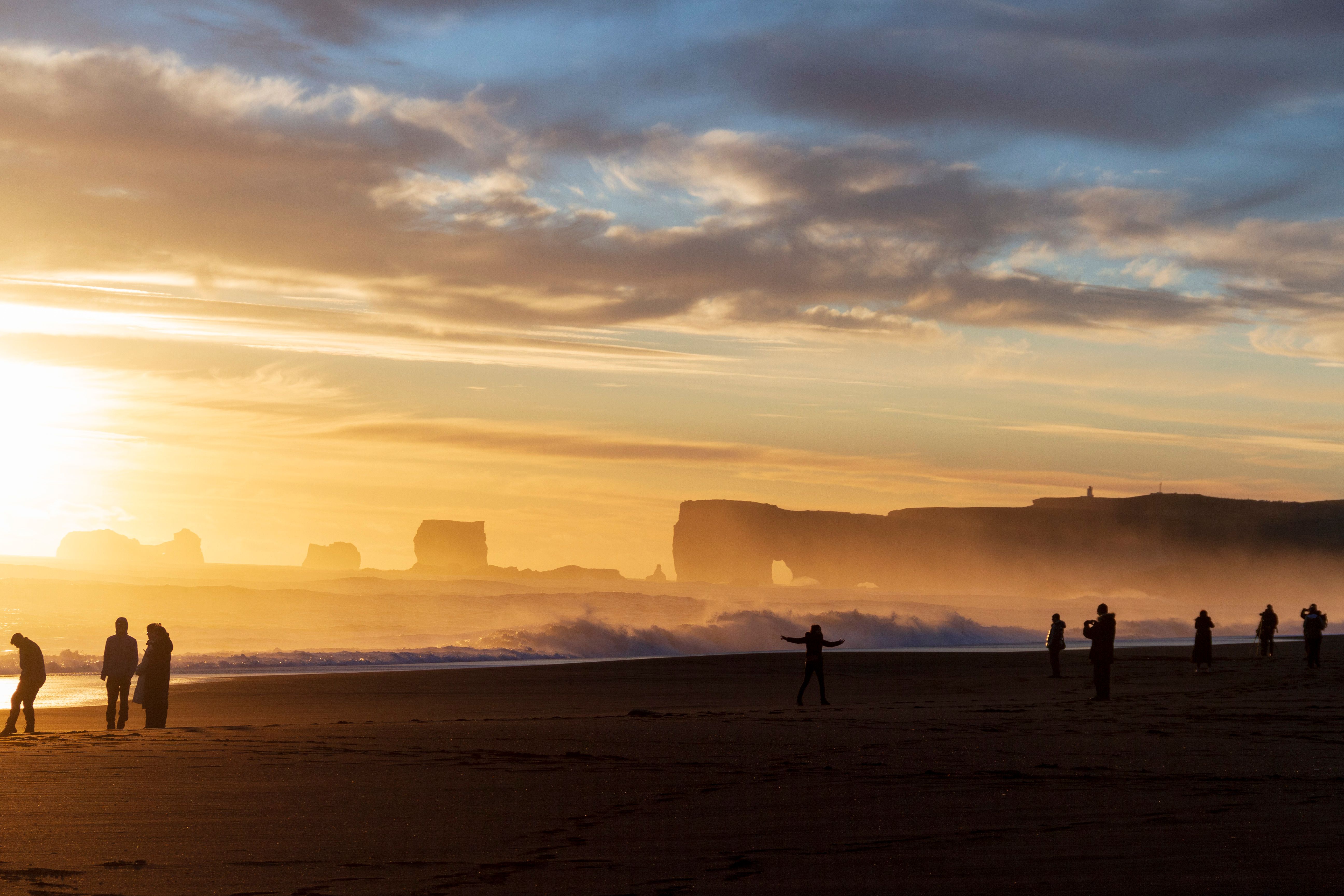 Silhouettes at Sunset on Scenic Ocean Beach · Free Stock Photo