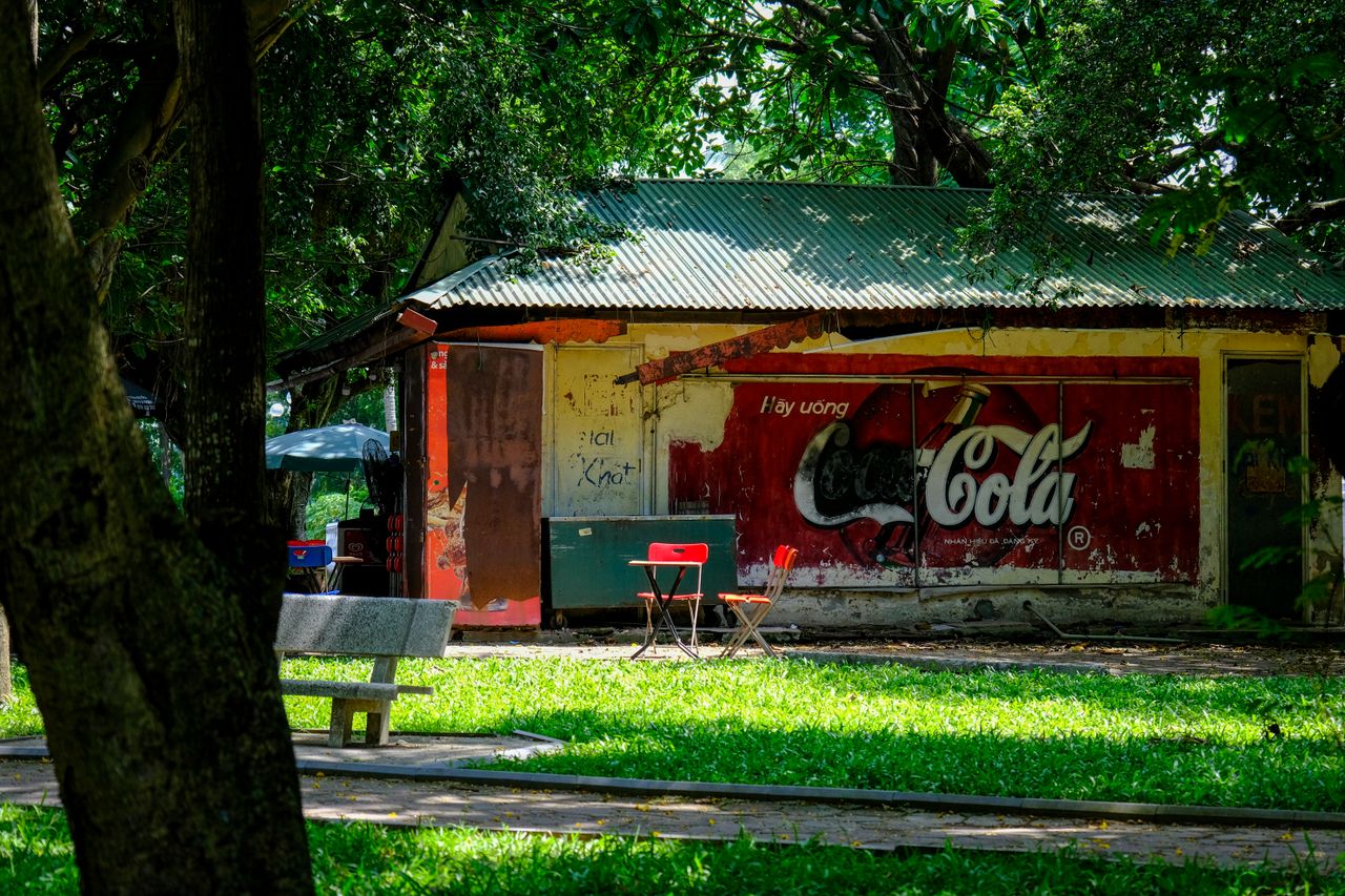 vintage coca cola stand in a verdant park ho chi minh city vietnam
