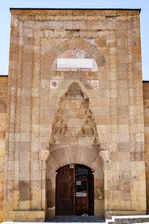 Free Stone facade of a historical building showcasing intricate architectural design and artistry. Stock Photo