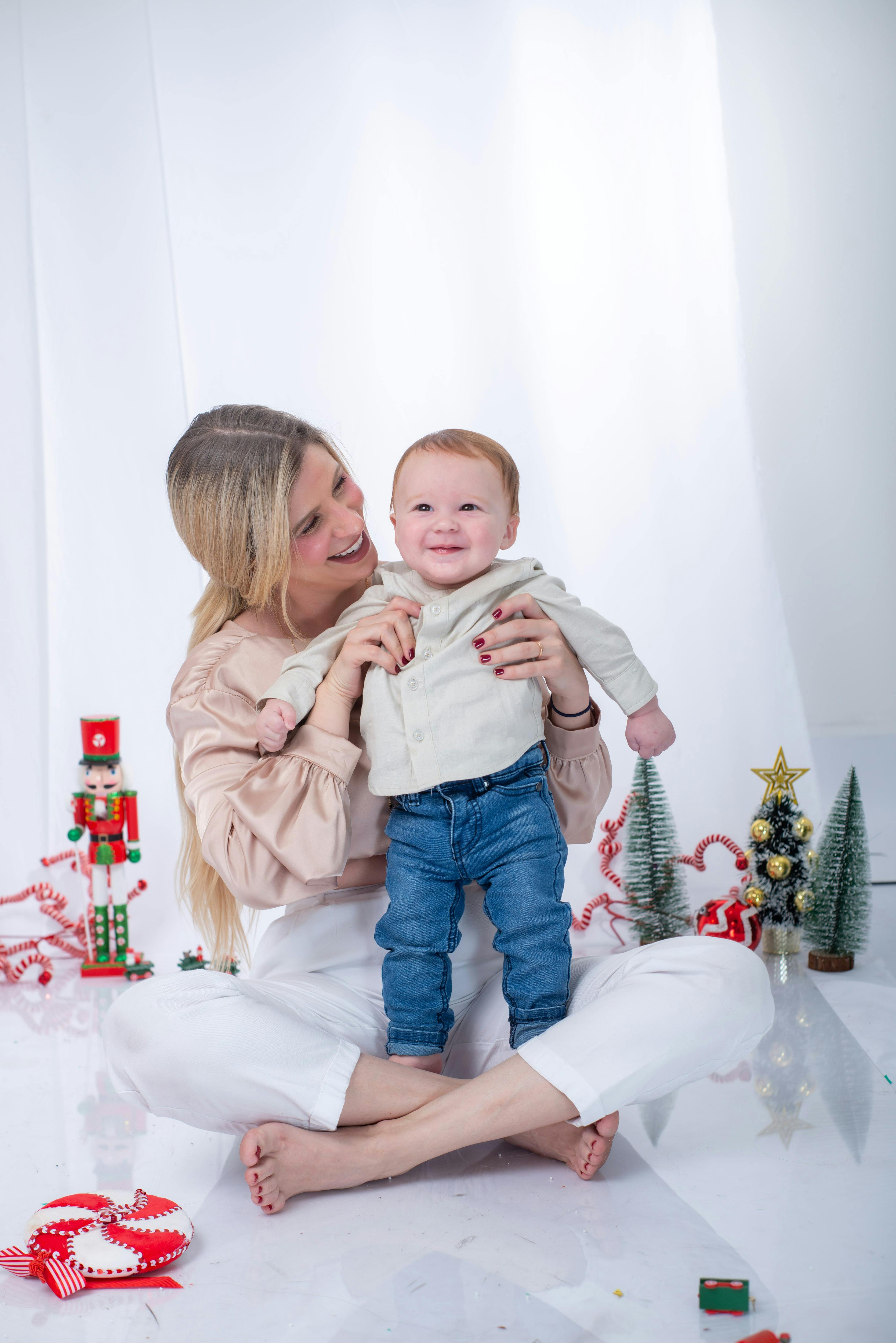 mother and baby enjoying christmas indoors