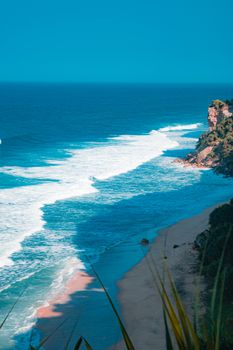 Breathtaking view of the coastline in Daerah Istimewa Yogyakarta, Indonesia with clear blue waters.