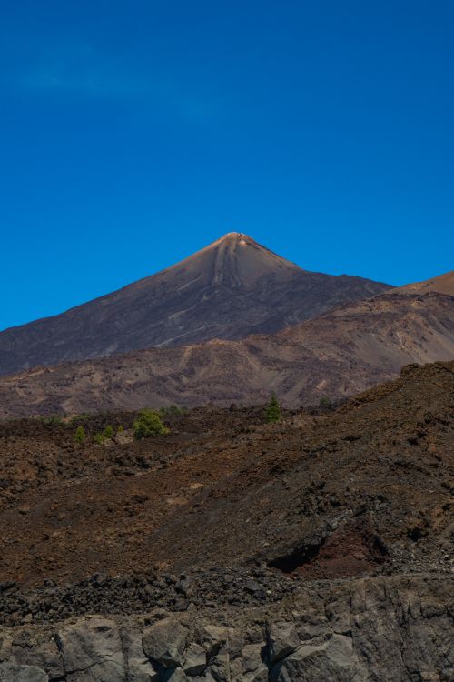 Free A stunning view of Mount Teide against a clear blue sky in Tenerife, ideal for nature and travel themes. Stock Photo