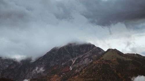 Free Majestic mountain peaks under cloudy skies in Tyrol, Austria. Perfect for travel and nature themes. Stock Photo