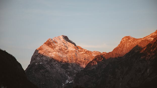 Majestic mountains in Tirol, Austria, bask in the warm glow of sunset.