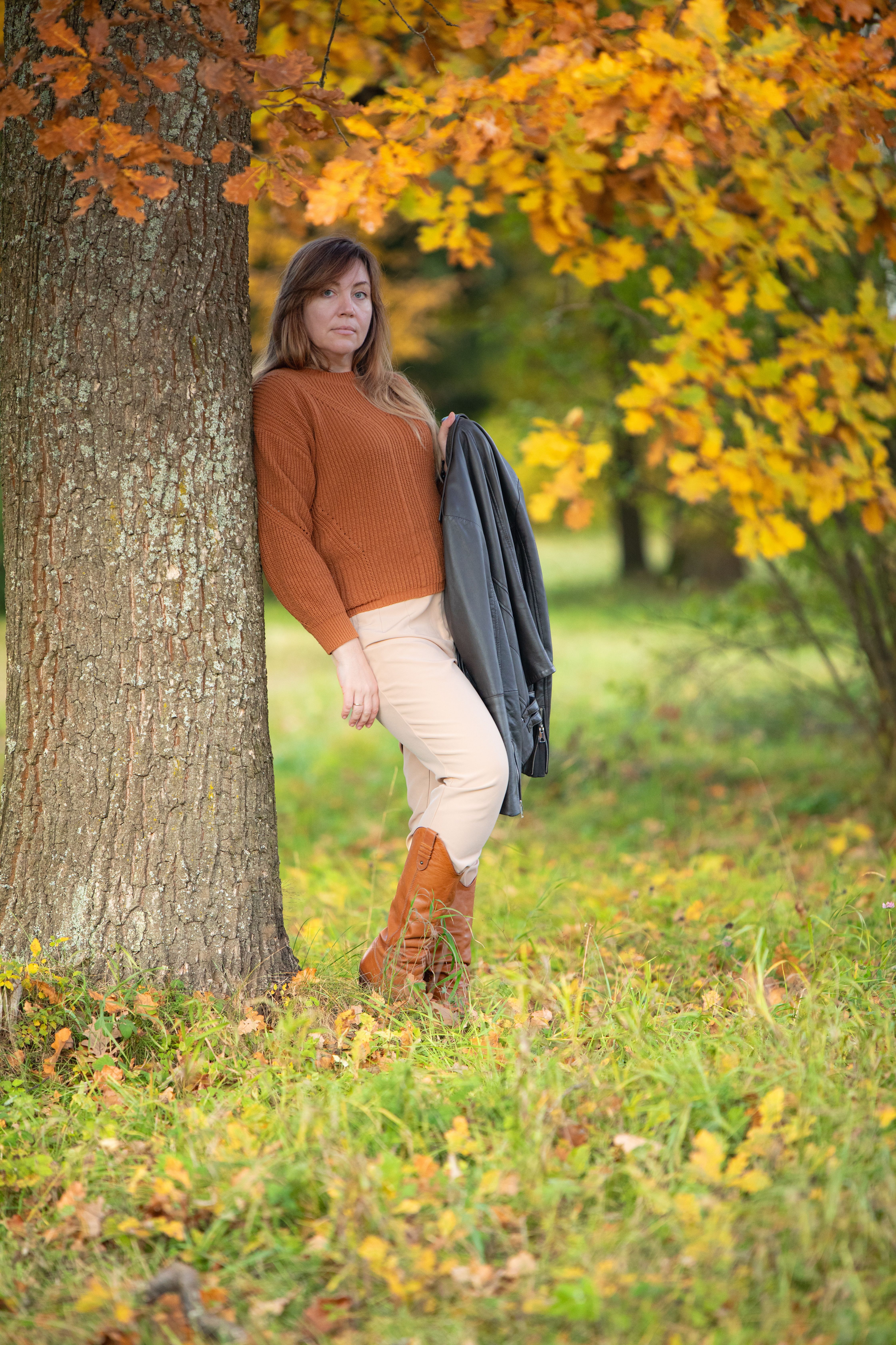 Woman Enjoying Autumn in a Forest · Free Stock Photo
