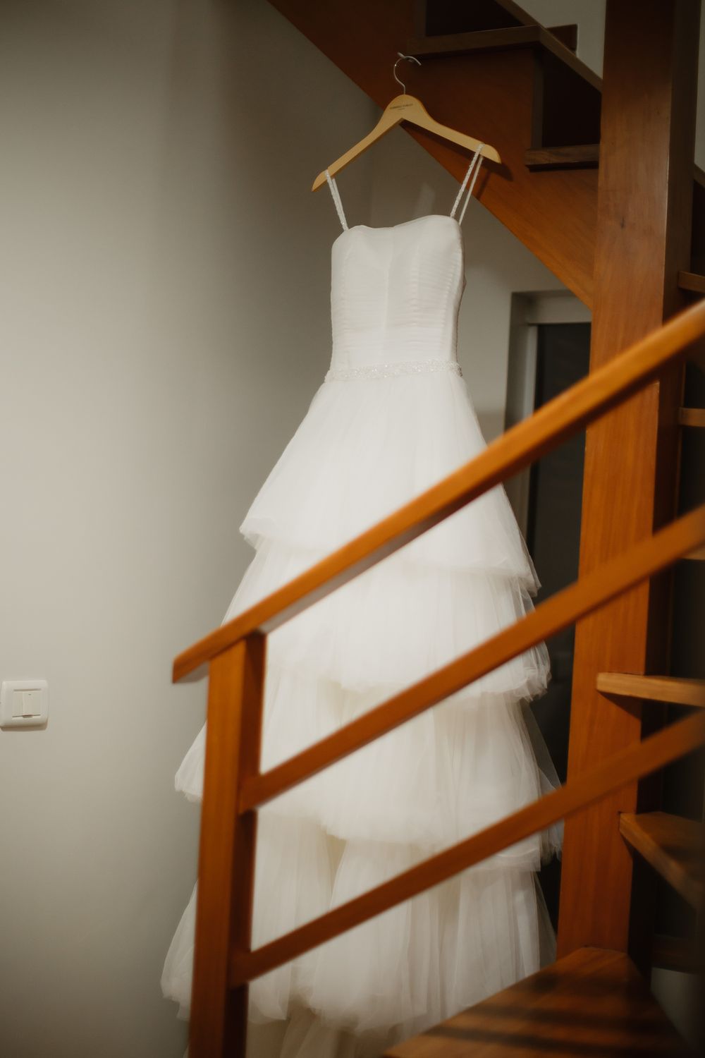 Elegant White Wedding Dress on a Hanger · Free Stock Photo