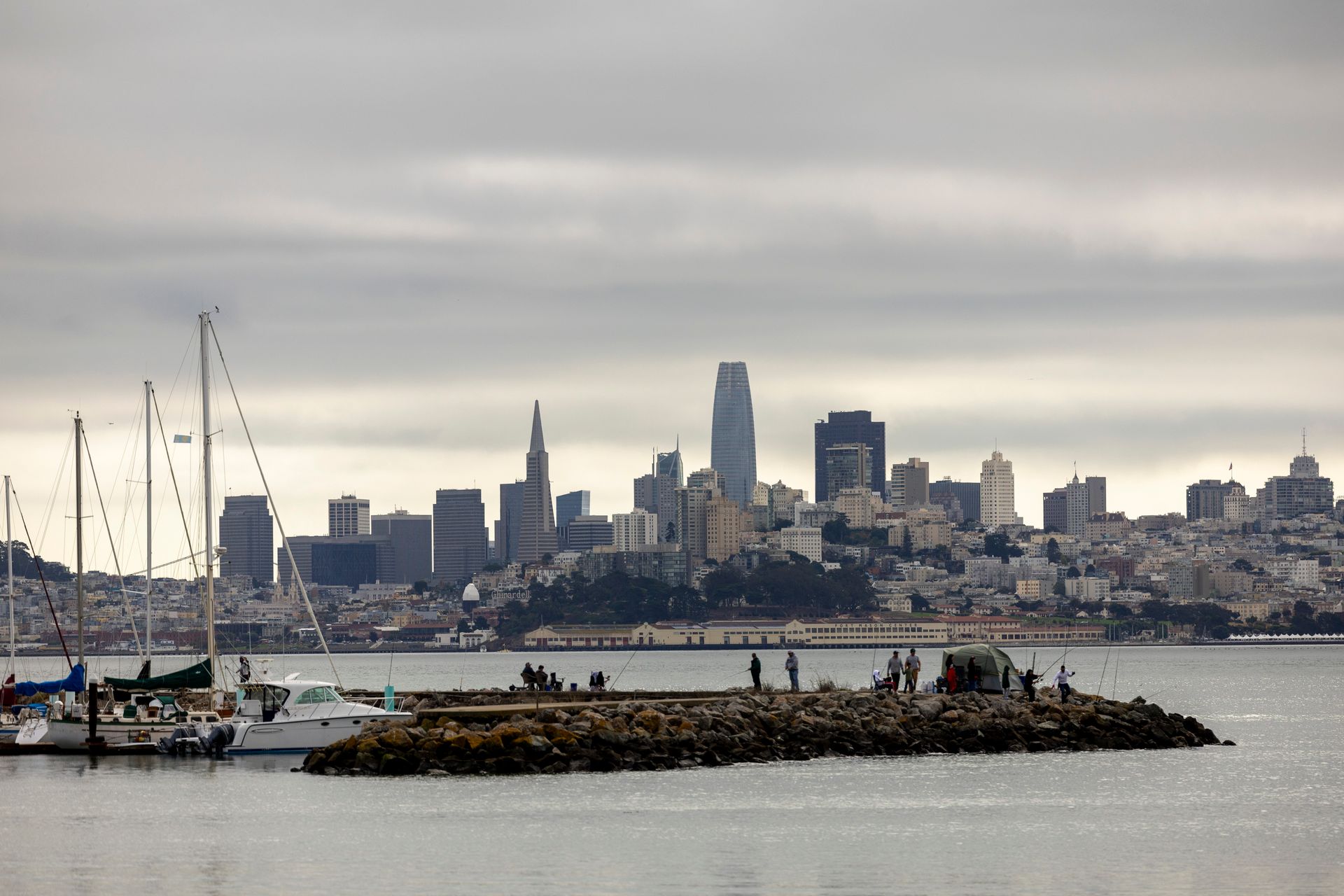 The San Francisco skyline seen across the bay from the northern waterfront, with sailboats moored inshore
