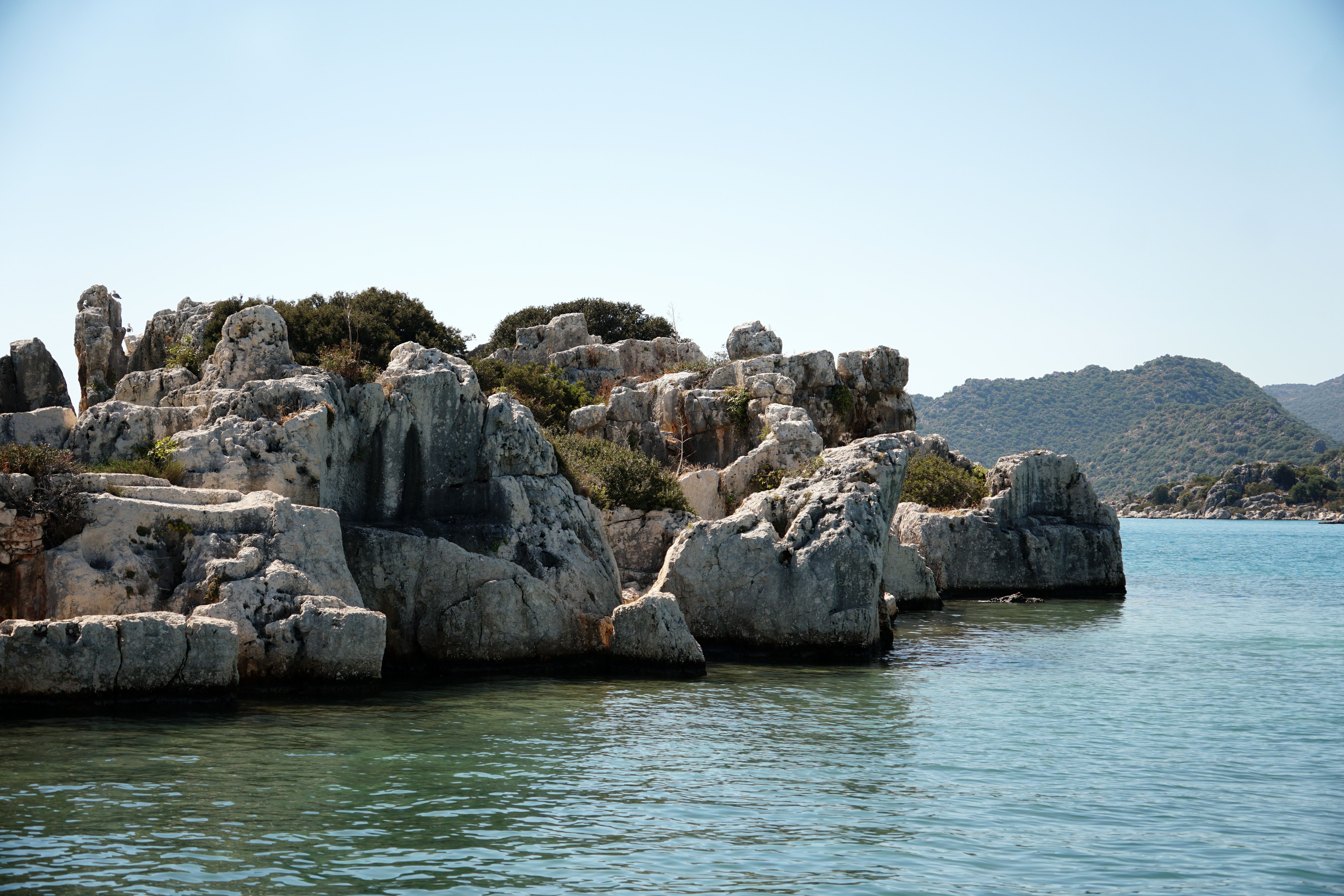 Rocky Coastal Landscape with Clear Blue Water · Free Stock Photo