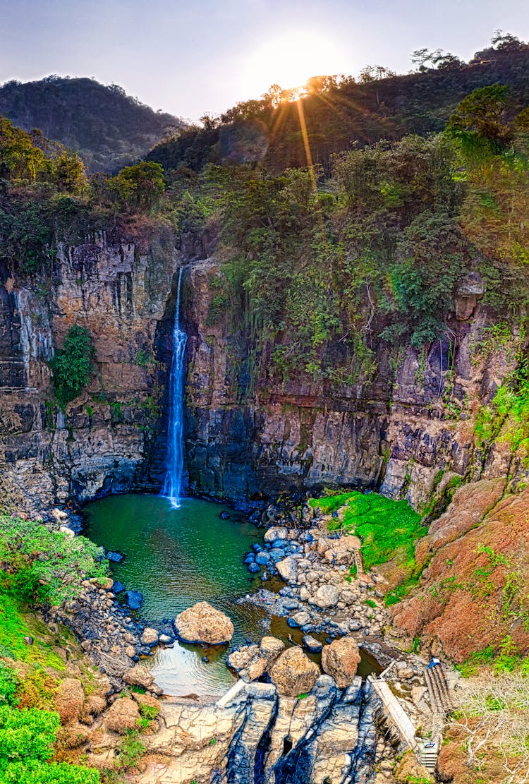 Waterfall And Rocky Mountain