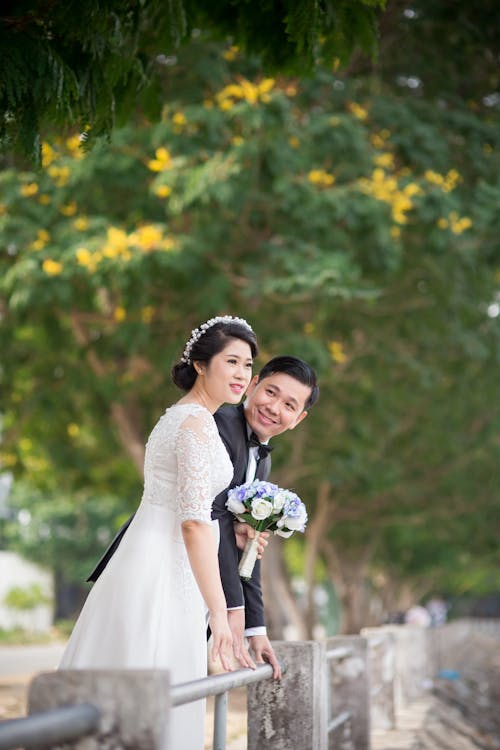 Photo Shoot Of A Wedding Coupe Beside Gray Balcony