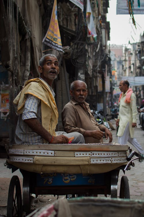 Two Men Riding on the Cart