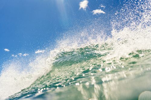 Free Captivating ocean wave captured in Mar del Plata, Argentina under a bright blue sky. Stock Photo