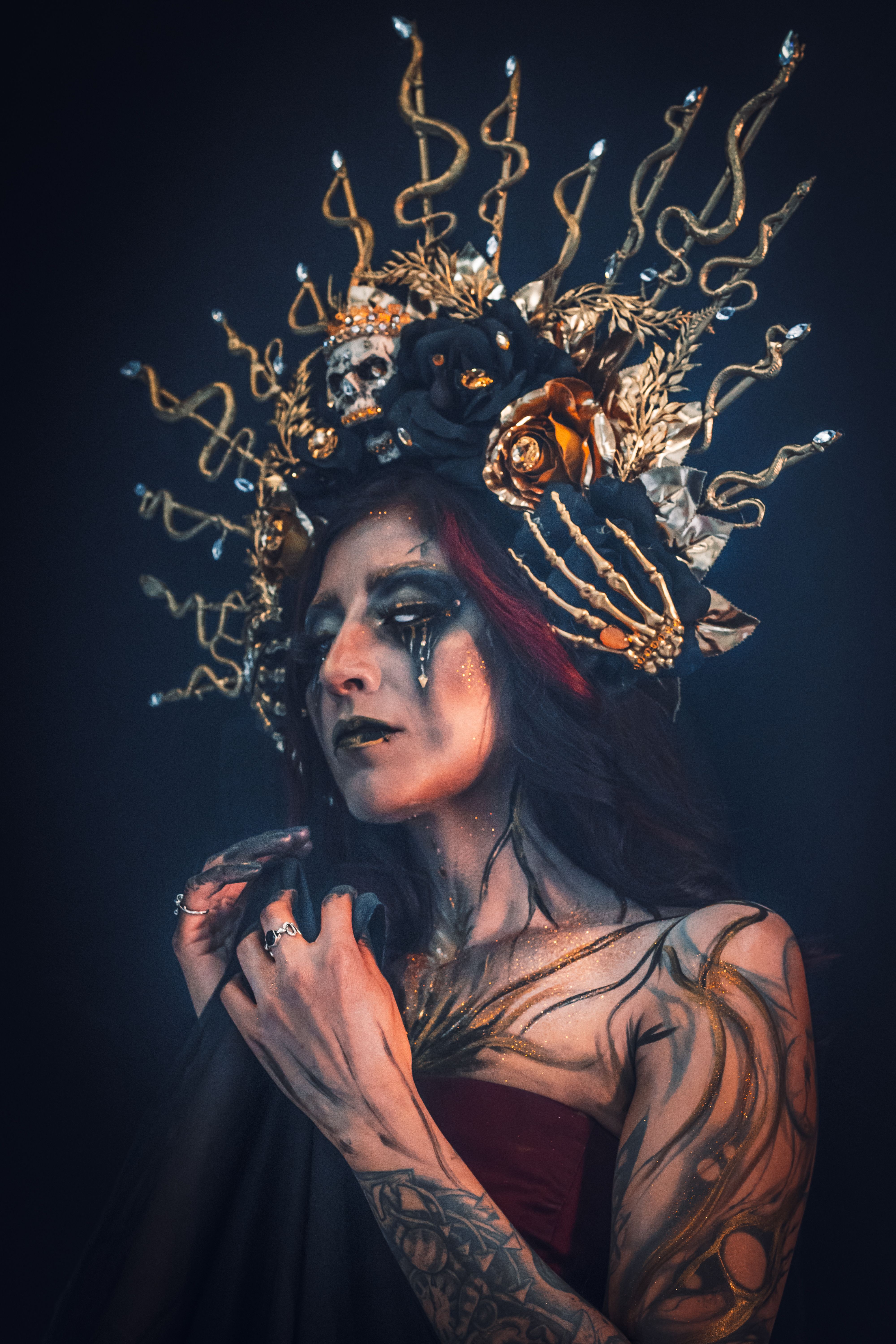 A gothic fantasy portrait featuring a woman with dramatic makeup and an elaborate headpiece, perfect for Halloween art.
