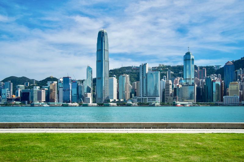 Hong Kong skyline in daylight along Victoria Harbour