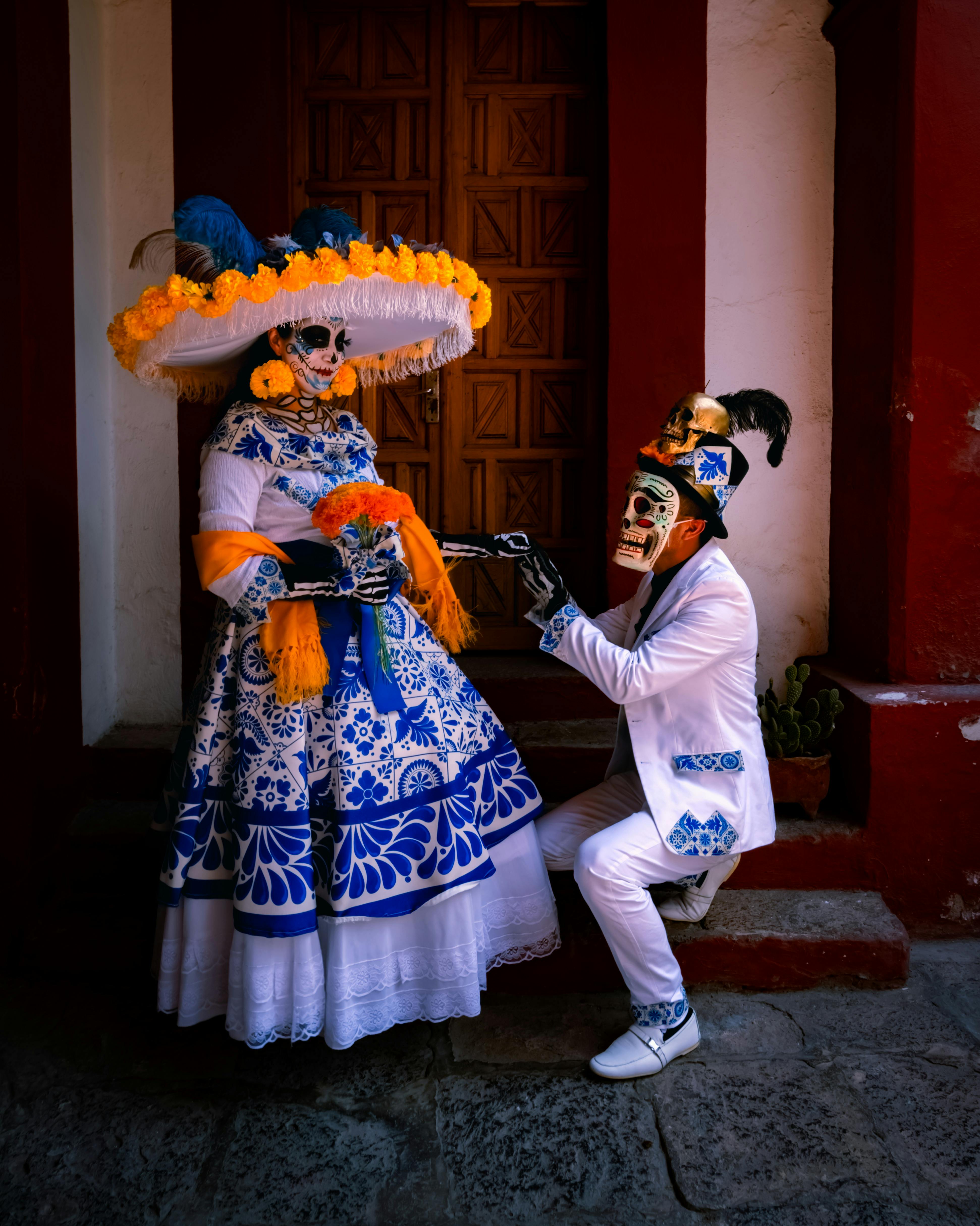 day of the dead couple in traditional costumes