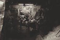 Artisan resting in a dimly lit sculpture workshop