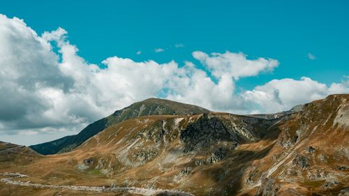 Free Majestic mountain range under a clear blue sky, ideal for travel and nature imagery. Stock Photo