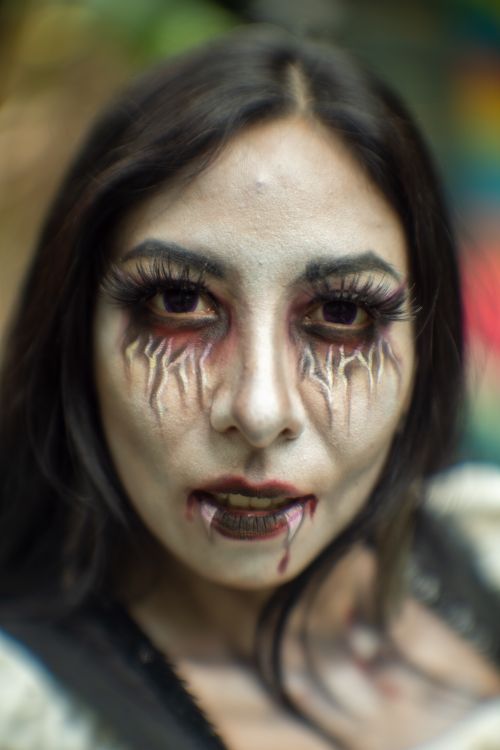 Free Close-up of a woman with dramatic Halloween makeup, creating an eerie effect, photographed in Mexico. Stock Photo