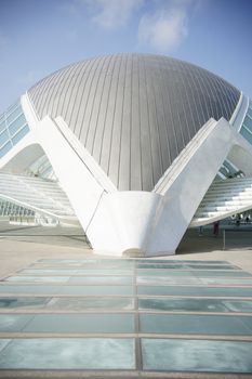 Futuristic architecture of L'Hemisfèric in Valencia, Spain captured under clear blue skies.