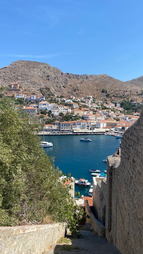 Free Stunning view of Hydra Island's harbor with traditional Greek architecture and clear blue waters. Stock Photo