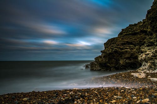 Time-lapse Photo of Body of Water and Rock