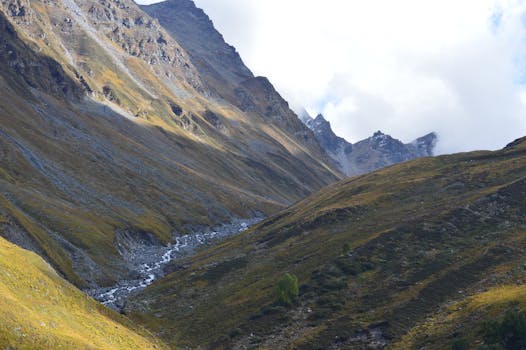 Breathtaking view of mountain terrain and stream in Himachal Pradesh, India.