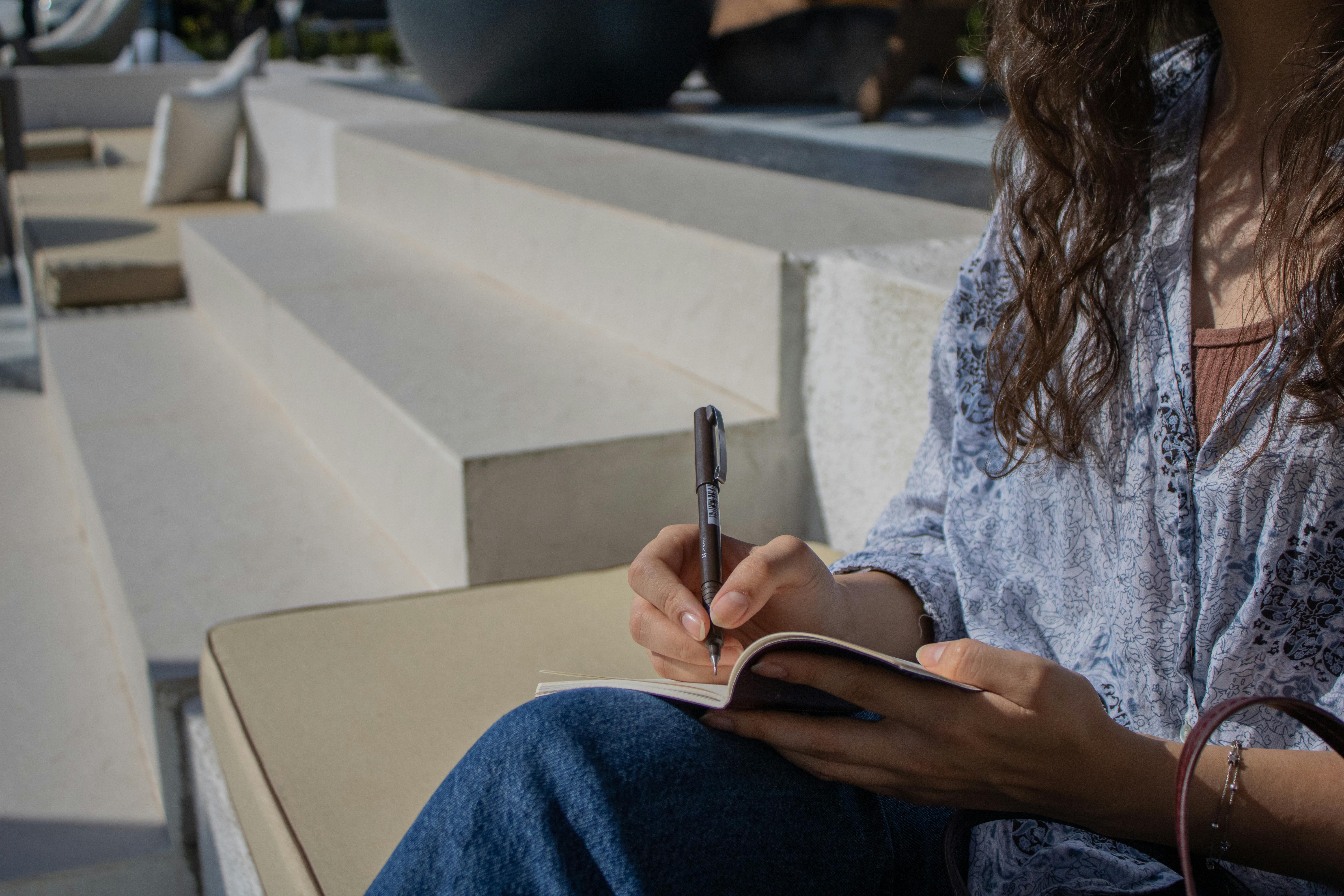 Woman Writing Outdoors in İstanbul, Türkiye