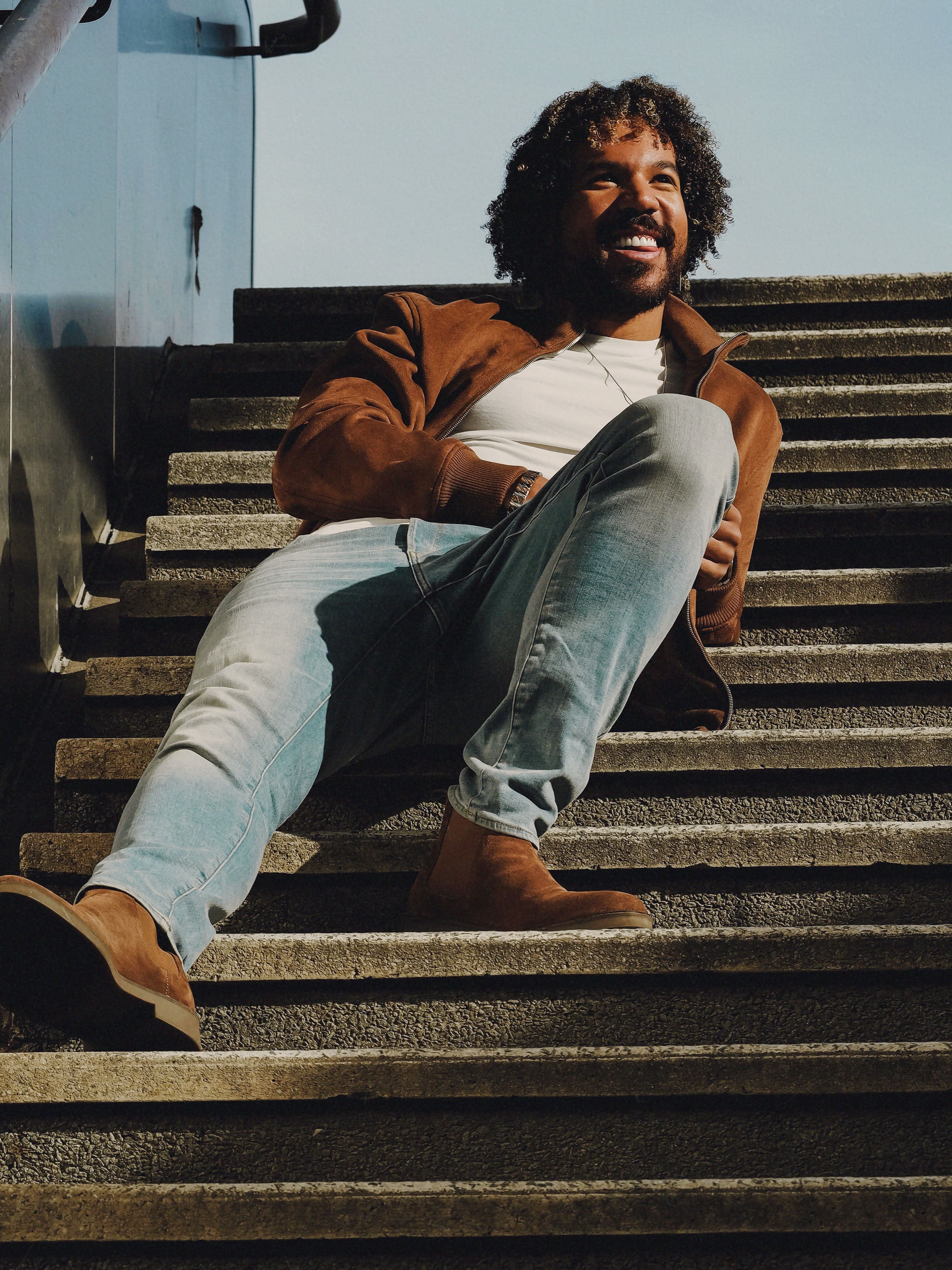 Photo of a Young Man Sitting on the Stairs · Free Stock Photo